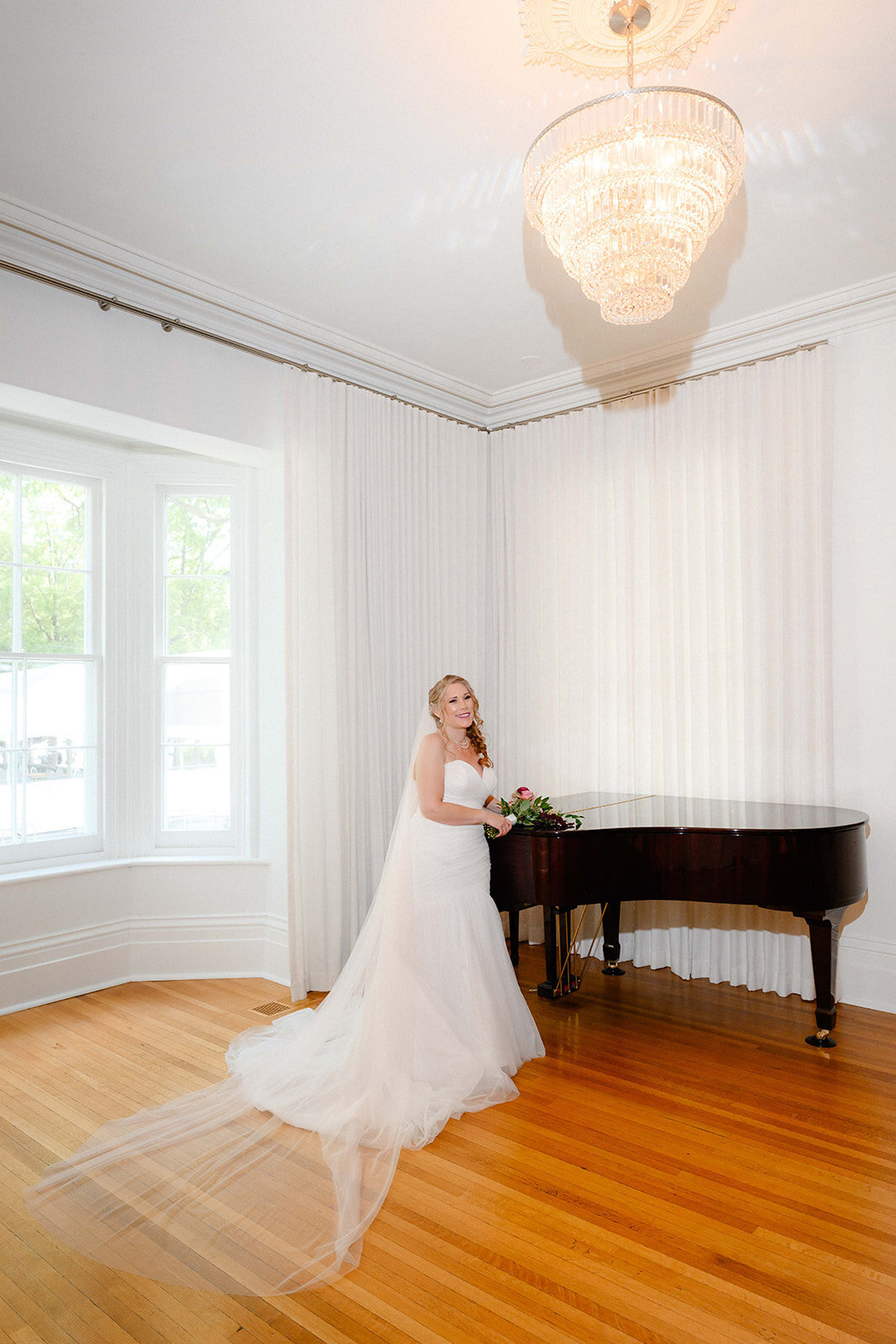 Bride beside the grand piano